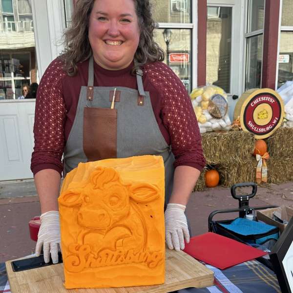 Photo of Vicki Janisch with cheese carving